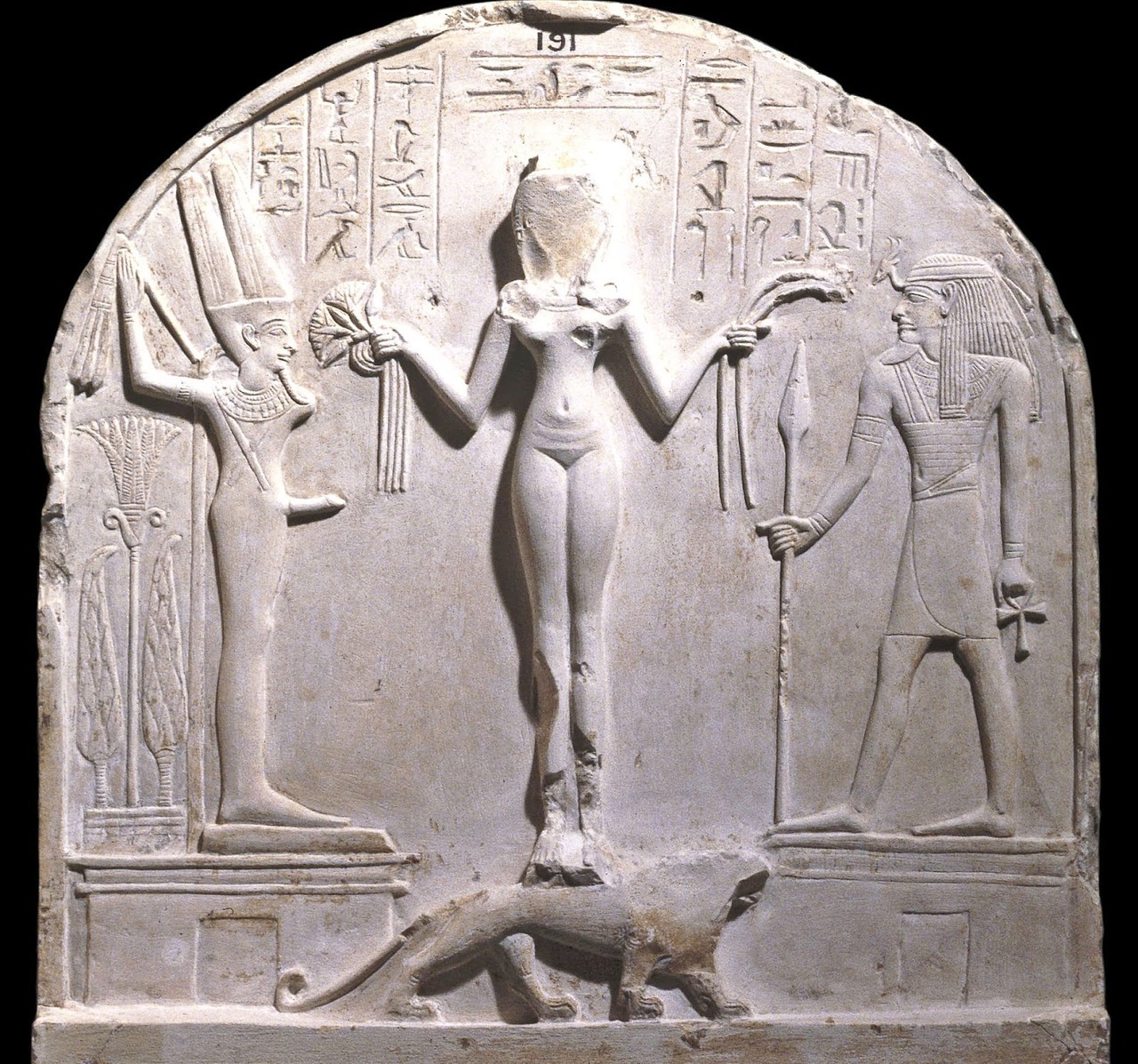 Ancient Egyptian Stele with Fertility GodsUpper register of limestone stele of chief craftsman Qeh, from Deir el-Medina. Naked goddess identified as ‘Qetesh, lady of heaven’, standing on a lion, flanked by the ithyphallic Egyptian god Min and...