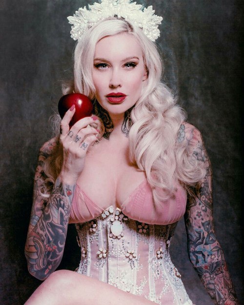 girl with tattoos girl with ink tattoo model tattoo sleeve corset knuckle tattoos red apple red lips blonde pearls