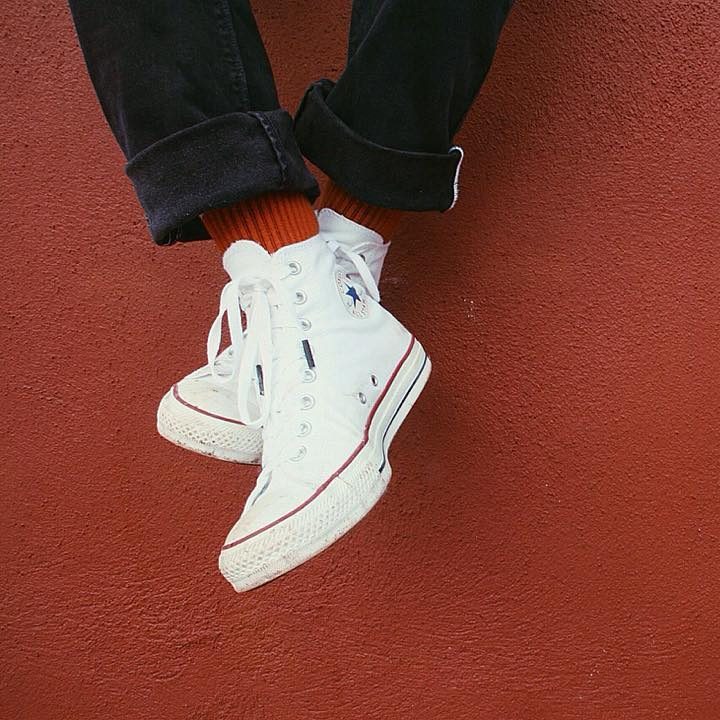 white high top converse on feet
