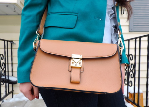 This small leather satchel adds a classic touch , perfect for carrying ...