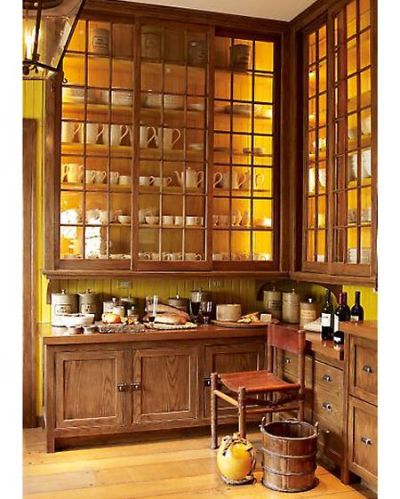 backlit shelving, with paned glass up to the ceiling.