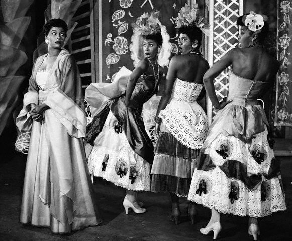 Pearl Bailey as Madame Fleur in the 1954 Broadway musical, House of Flowers, with her “flowers”, Josephine Premice (Tulip), Enid Mosier (Pansy) and Enid Moore (Gladiola). Image via Corbis.