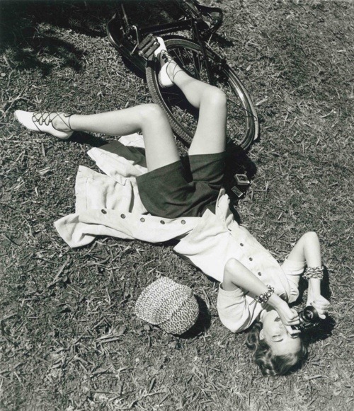 theniftyfifties:A girl in the park with a bike and her camera....