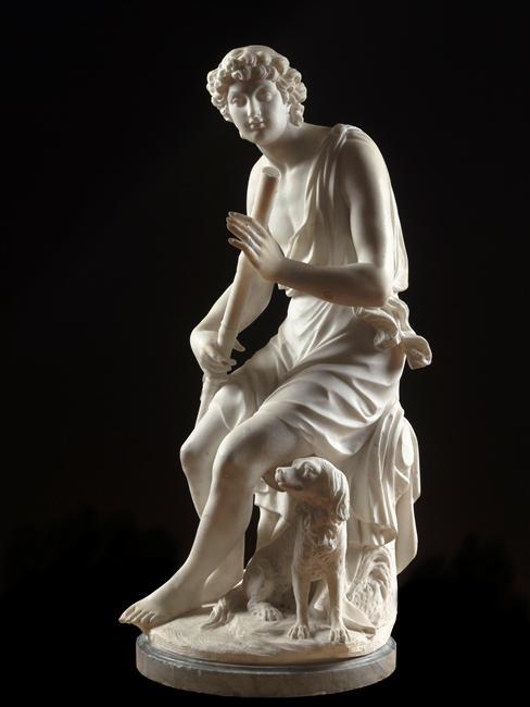 A statue of a shepard boy holding a flute, with a dog at his feet, by Jean-Francois Lorta (1783) for the chateau de Bellevue