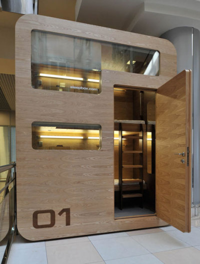 Russian architects Arch Group have completed the first of their tiny hotel rooms for napping at airports. The Sleepbox unit at Moscow’s Sheremetyevo airport contains two beds and can be rented for between 30 minutes and several hours. The pod is equipped with LED reading lamps as well as sockets for charging laptops and mobile phones.<br /><br /><br /><br />Imagine the situation where you are in a modern city, you are not a local resident, and you have not booked a hotel. It is not a comfortable situation because modern aggressive cities give you no opportunity to rest and relax. If you want to sleep while waiting for your plane or train, you face many security and hygiene problems. We believe that urban infrastructure should be more comfortable. For this purpose we have developed Sleepbox. It provides moments of quiet sleep and rest without wasting time in search for a hotel.<br /><br /><br /><br /><br /><br />Possible locations for Sleepbox include:<br /><br /><br /><br />Railroad stations<br />Airports<br />Exhibition centers<br />Public and shopping centers<br />Accommodation facilities<br />Available options include:<br /><br /><br /><br />Matted film on windows with changing transparency<br />Mood lighting – LED lamps with changing light colors<br />Built-in media block (TV, touch-screen monitor)<br />Wi-Fi router<br />Alarm, intercom<br />Safe deposit box<br />Built-in payment station with magnetic keys<br />