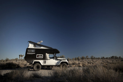 architizer:<br /><br />The Jeep ActionCamper replaces the iconic Jeep “roll cage” with a lightweight, fiberglass mobile camper, equipped with bed, kitchen and storage.<br />