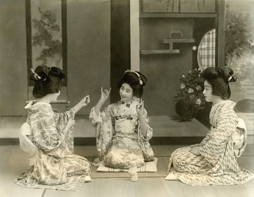 Playing Kitsune-ken or Fox Fist (1937)
“ “A variation on the “rock, paper, sissors” hand game, played by Geisha and their customers, this particular version of the game was at its most popular from the late Edo period (1820s) to the end of the Meiji...