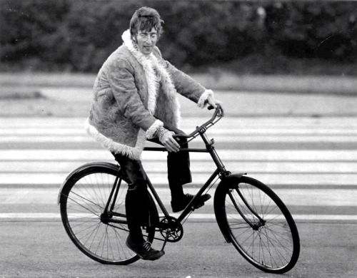 John Lennon on a bike, 1967.