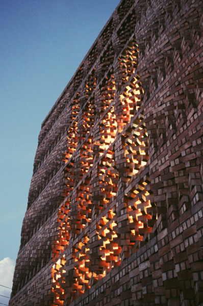 remagine:<br /><br />New Dehli-based Anagram Architects have designed this impressive facade as part of their office building for the ‘South Asian Human Right Documentation Centre’,  or SAHRDC, a non-governmental rights organization in New Dehli, India. It’s based on a modular systems of 6 bricks - we like that the wall hasn’t been painted or plastered over, the rawness of the material gives the illusion of movement, balance and transformation… a bit like Transformers’ Jenga, but we won’t be trying to remove any bricks any time soon…<br /> via designboom<br />