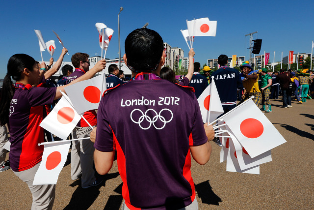 Olympic Moments — The Japanese team arrives at the athlete welcome...