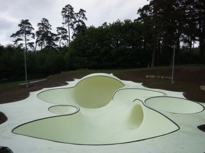 shinyslingback:<br /><br />glow-in-the-dark skatepark<br />koo jeong-A has designed a concrete sculpture which features a composition of different bowls connected by three different tunnels. located on vassivière island in france, ‘otro’ stands as a fully functioning skatepark, but this one’s a little bit different - it’s glow-in-the-dark eliminating the complications of an evening skate session. drawn to the surrounding mysterious wooded french landscape, the korean artist wanted to create a dreamscape amidst the natural surroundings. the artwork is something that is meant to live and be used providing a sensorial experience to skaters and spectators alike.<br />http://www.designboom.com/weblog/cat/8/view/22814/glow-in-the-dark-skatepark.html<br />