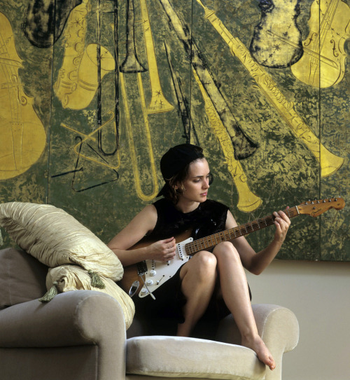 briennewalsh:Winona Ryder, playing guitar in her apartment,...